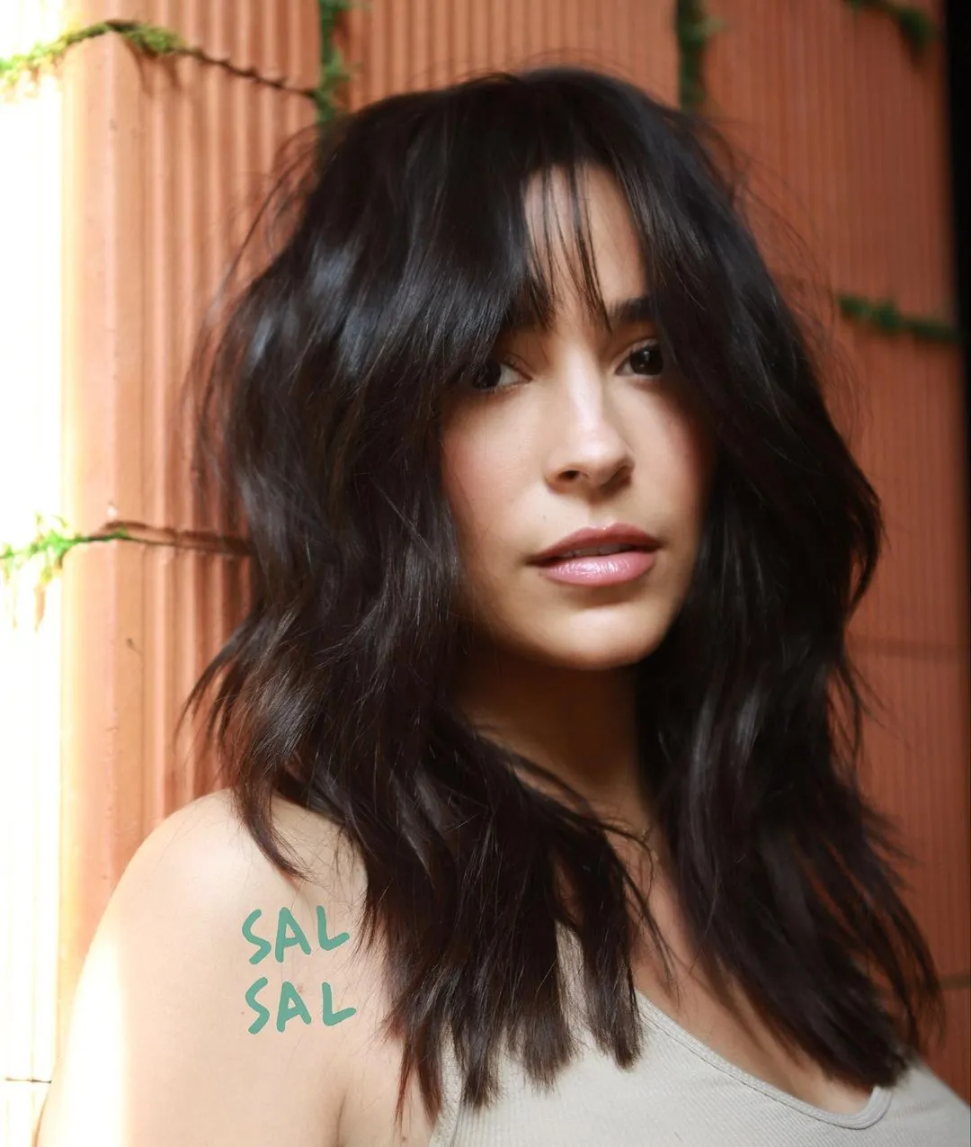 Feathered Wavy Haircut with Thin Bangs