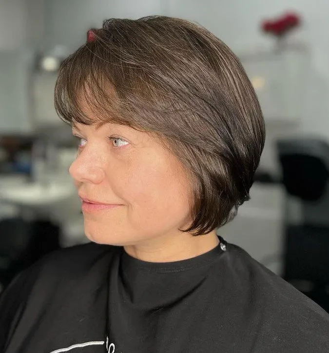 Short Layered Bob Hairstyle with Wispy Bangs