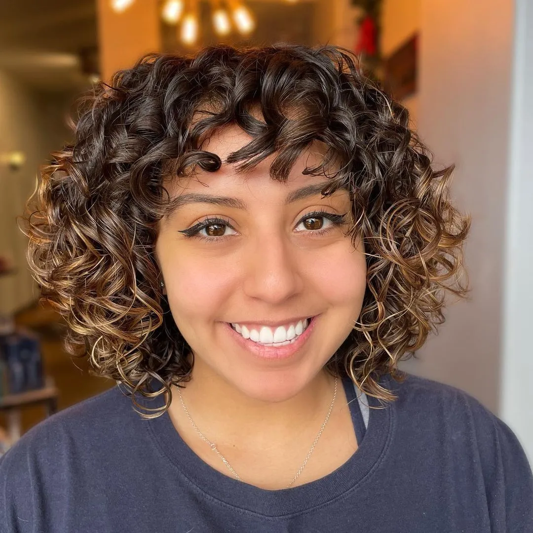 Permed Layered Bob with Bangs and Highlights