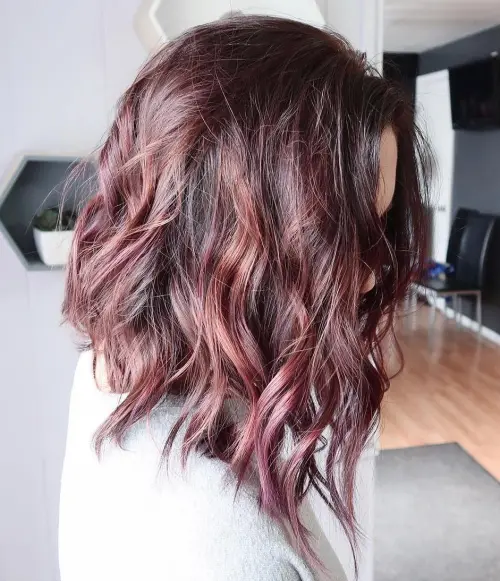 Angled Burgundy Lob with Tousled Waves Angled Wavy Lob Hairstyle