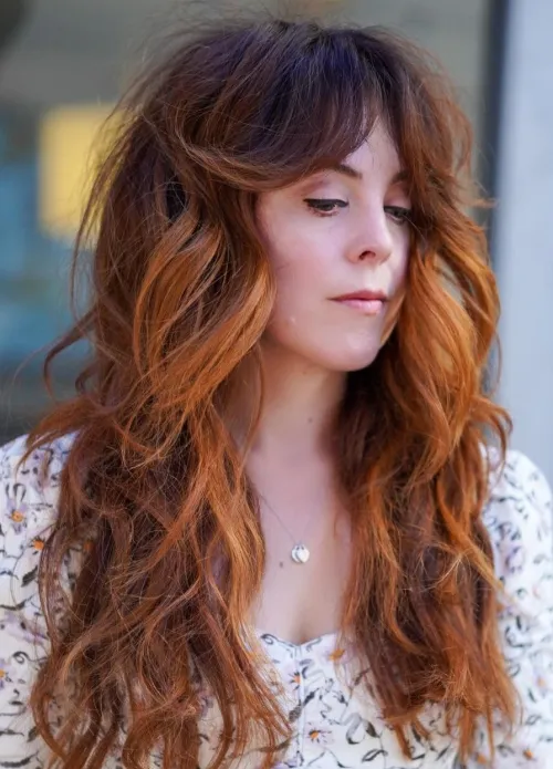 Long Wavy Hair with Curtain Bangs Long Layered Wavy Hair with Bangs Flicked to the Sides