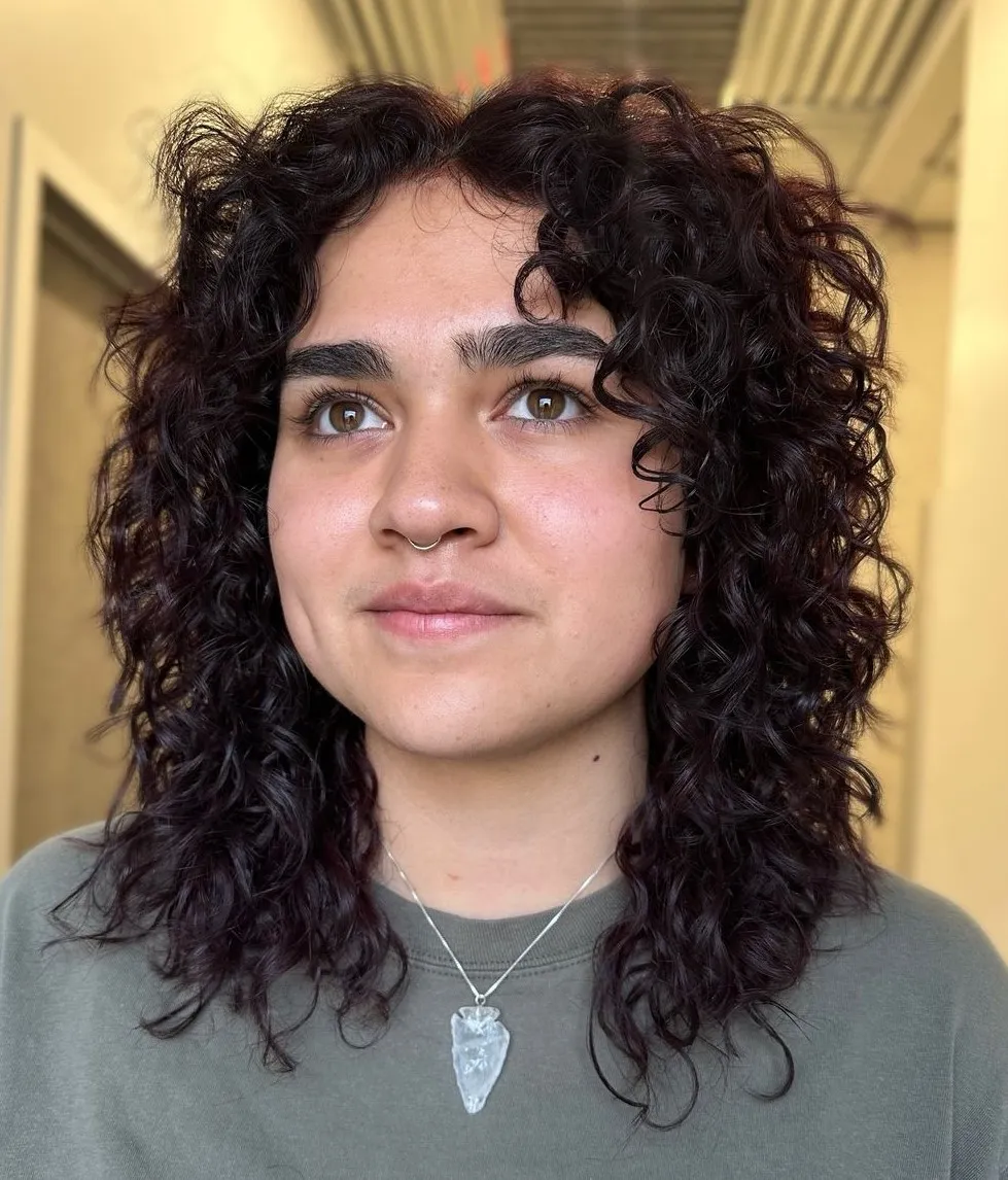 Mid Length Curly Haircut with Middle Part