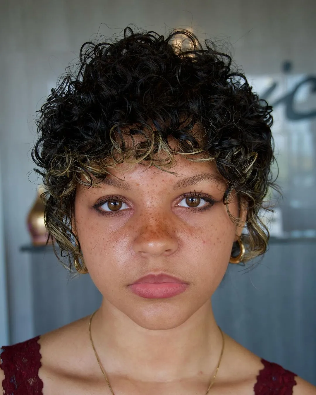 Bold Curly Pixie with Face Framing Bangs