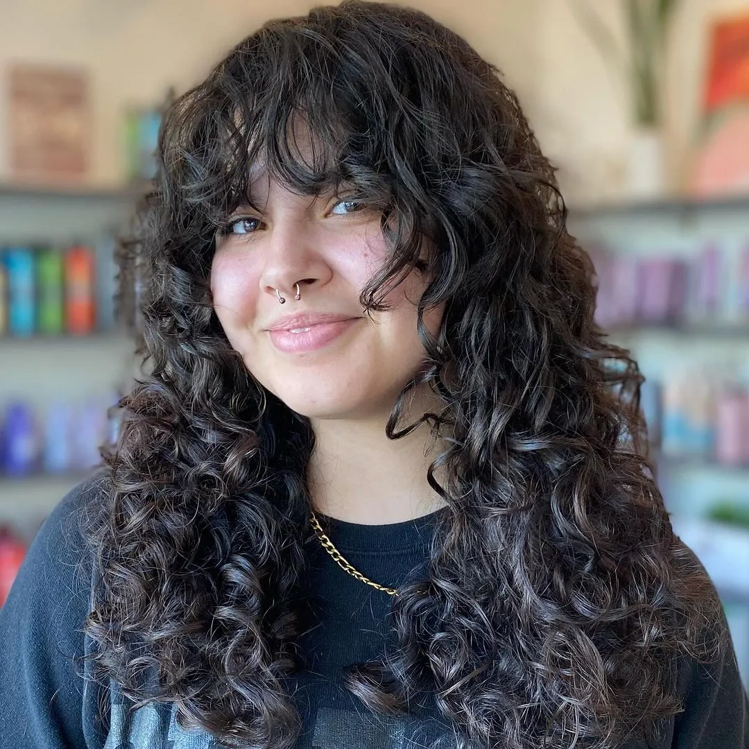 Long Curls and Eyebrow Grazing Fringe