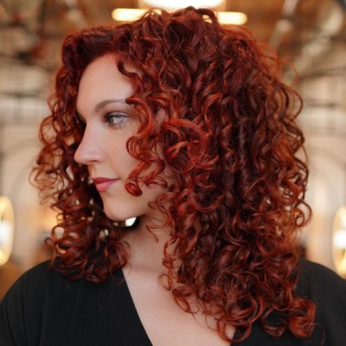 Red Curly Hair with Face-Framing Layers Fiery Red Layered Style on Curly Hair Texture