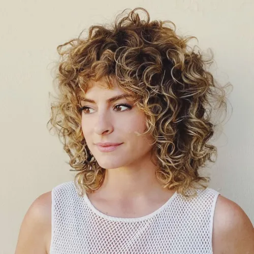 Curly Shaggy Bob with Blonde Highlights Voluminous Razored Bob for Curly Hair Type