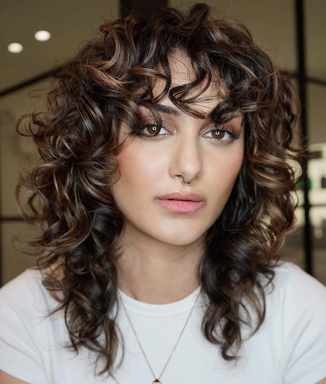 Ash Blonde Curly Hair with Black Roots