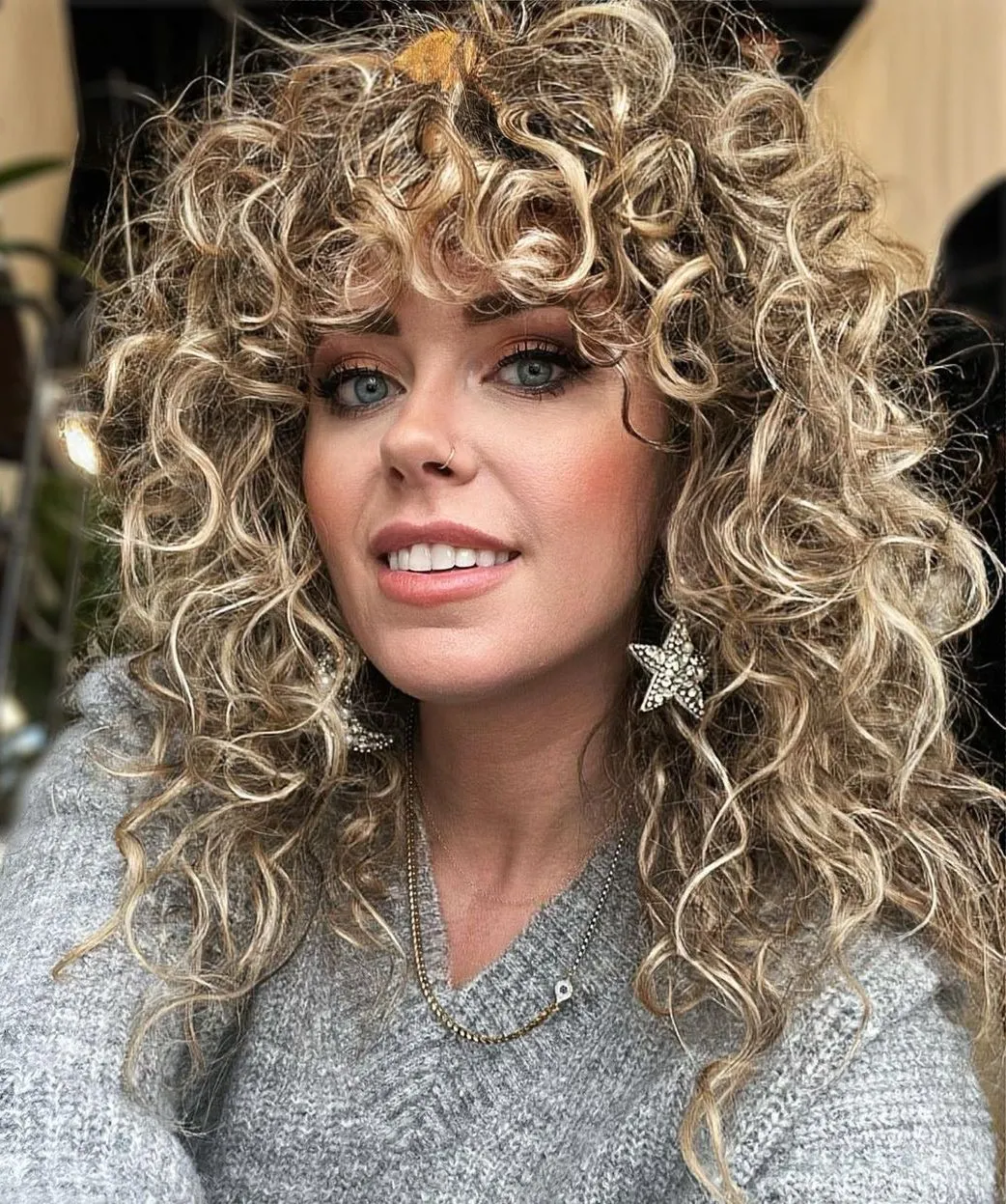 Curly Shag with Bangs with Blonde Highlights and Lowlights