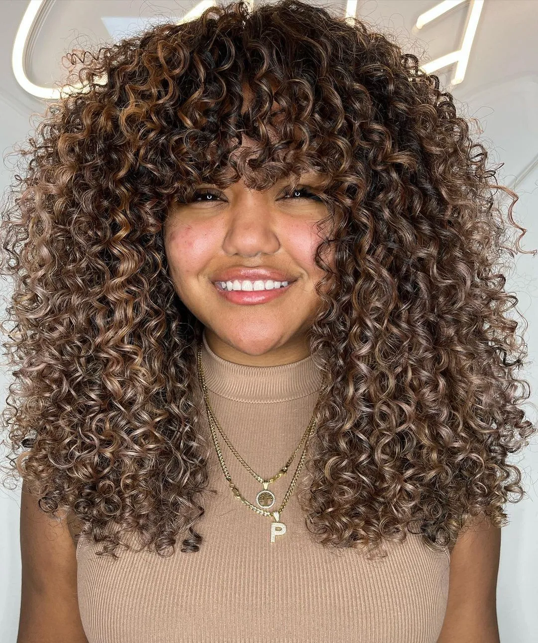 Warm Brown into Dirty Blonde Fade on Tight Curls