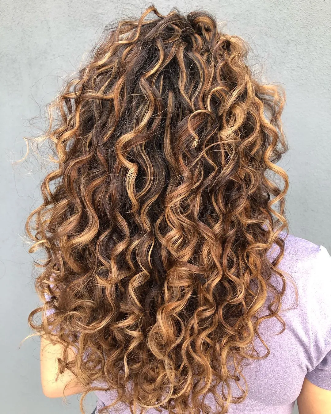 Golden Blonde Highlights in Long Brown Curly Hair