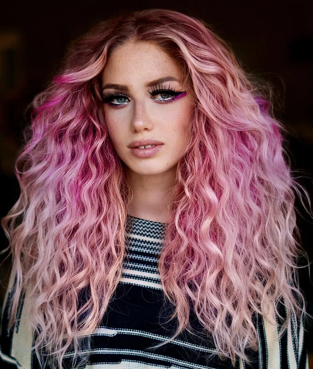 Berry and Pastel Pink Balayage on Naturally Wavy Hair