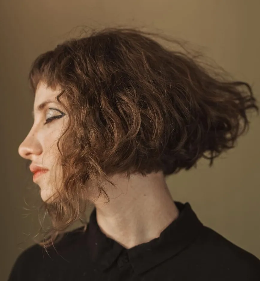 Wavy Bob with Short Bangs and Longer Face Framing Strands