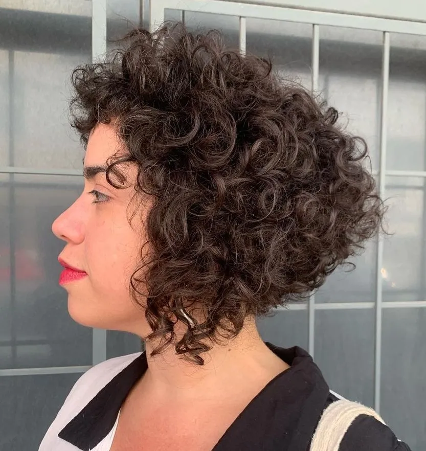 Chin Length Curly Bob with Bangs and Stacked Layers