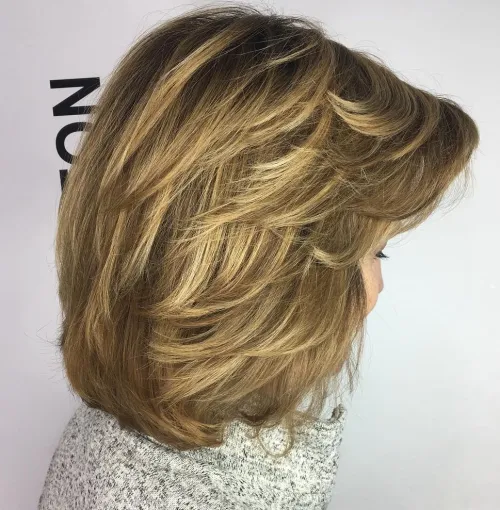 Medium Feathered Hairstyle For Thick Hair