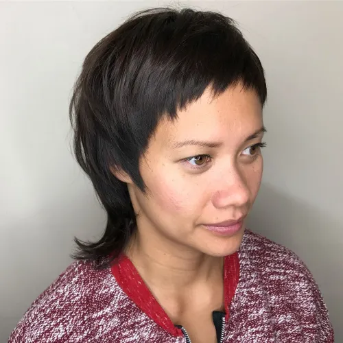Female Mullet with Baby Bangs and Flipped Ends