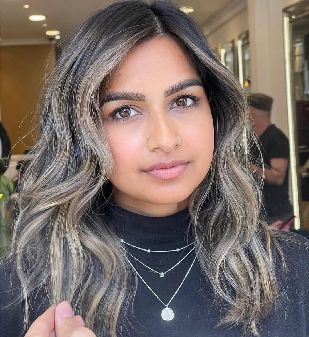 Medium Waves with Ashy Balayage Cool Toned Face Framing Highlights for Round Face