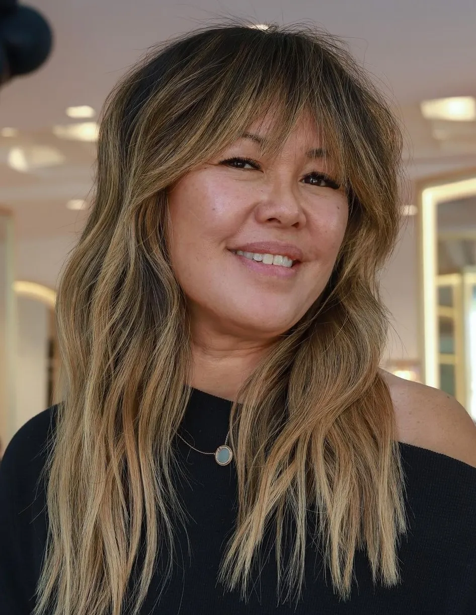 Highlighted Shaggy Haircut with Bangs Long Layered Hair with Elongated Bangs