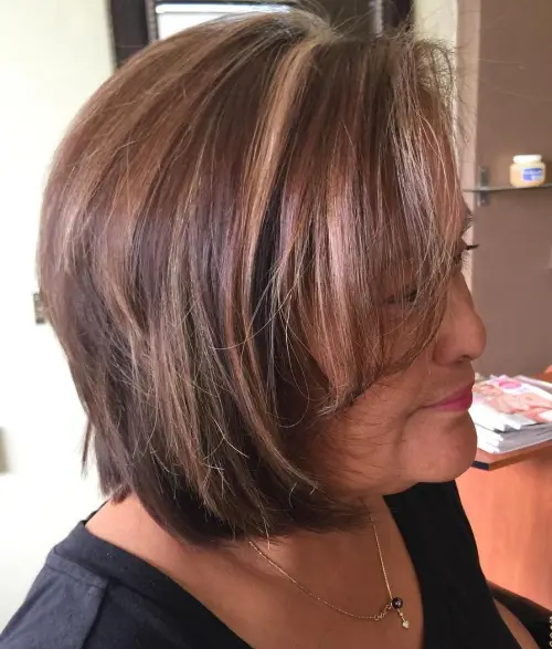 60 Elegant Hairstyles for Women Over 60 to Match Every Preference 52 Older Women's Brown Bob With Highlights