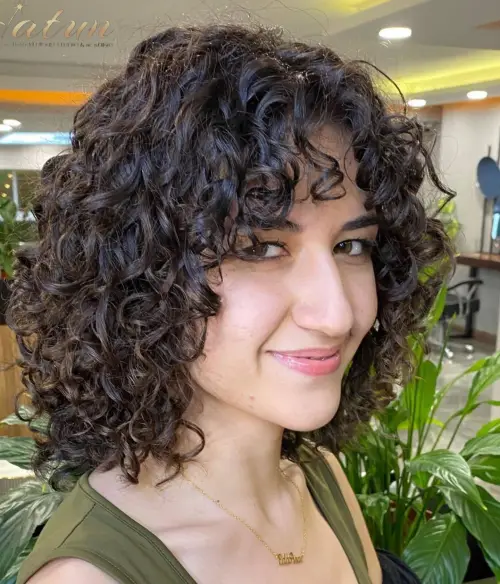 Medium Layered Brunette Perm Hairstyle