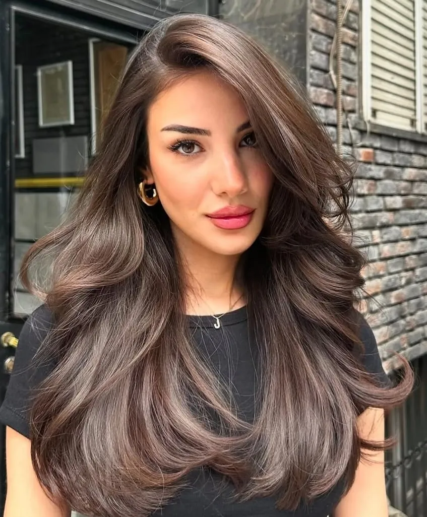 Side-Swept Blowout Style Long Layered Hairstyle for an Oblong Face