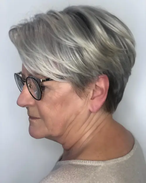 30 Hairstyles That Can Shave a Decade Off Your Appearance 19 Silver Pixie with Lowlights to Look Younger