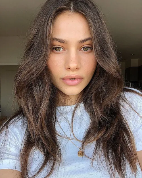 12 Different Hair Types: Identifying and Styling Yours 5 Woman with 1C Type of Hair