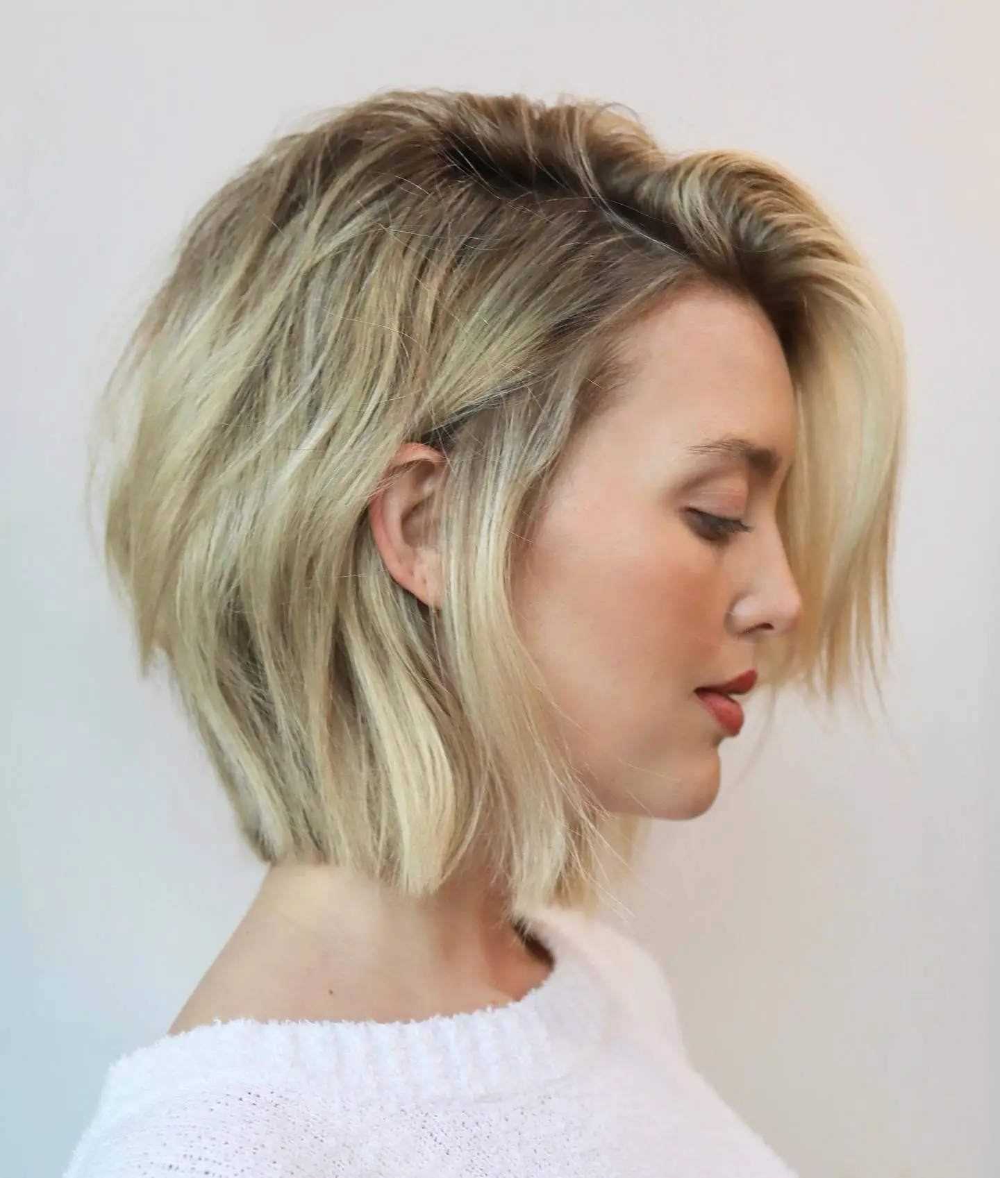 Dimensional Blonde Haircut Tousled Layered Bob with Balayage