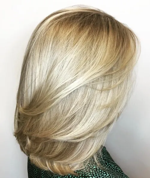 Medium Blonde Hairstyle With Feathered Layers
