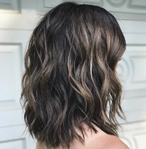 Shoulder-Length Layered Cut For Wavy Hair