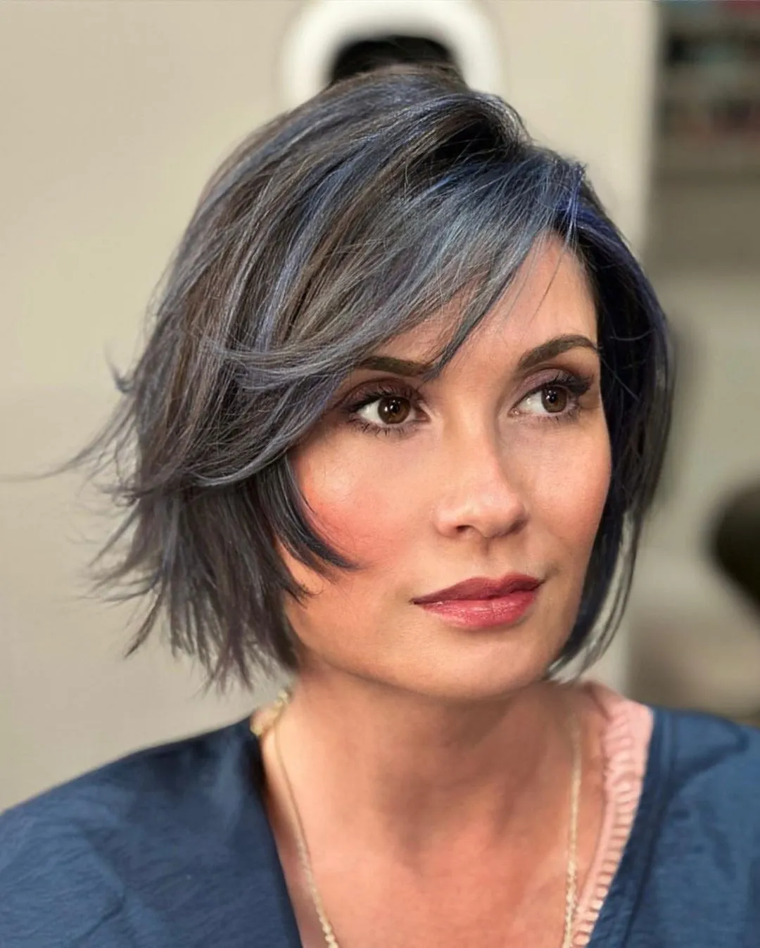 Feathery Chin-Length Bob with Bold Highlights Bob with Wispy Layers and Blue Highlights