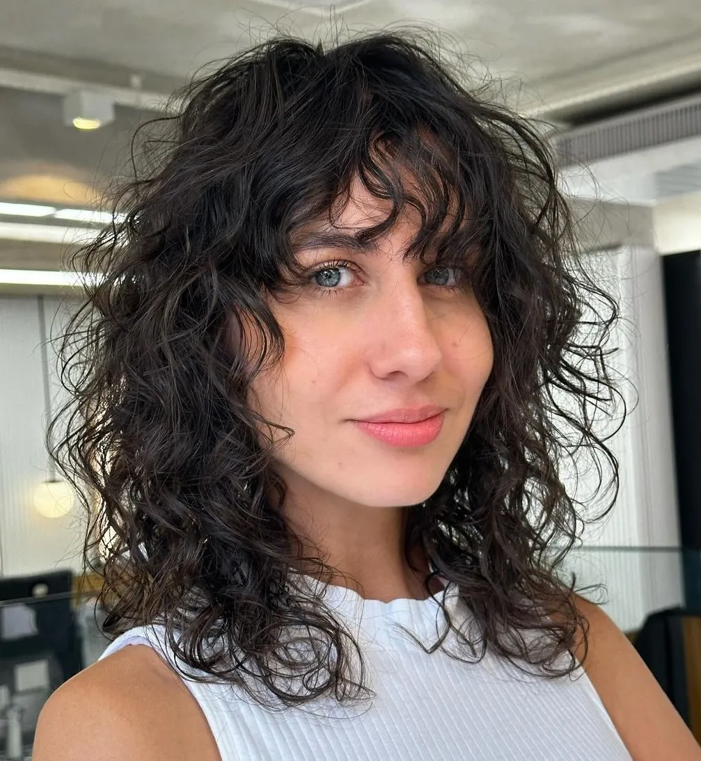 Medium Curly Shag with Wispy Bangs