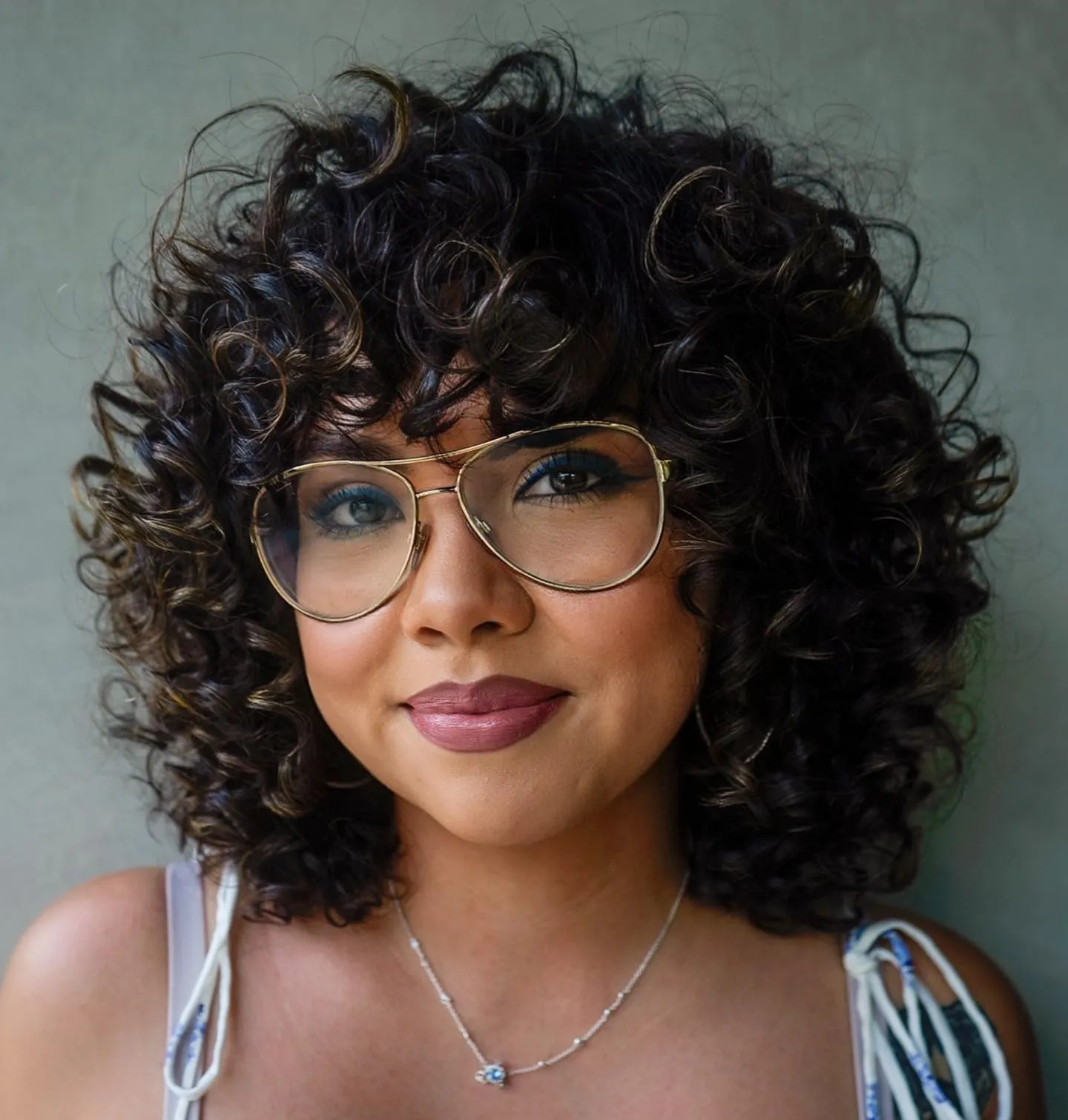 Pear Face Voluminous Curly Hairstyle