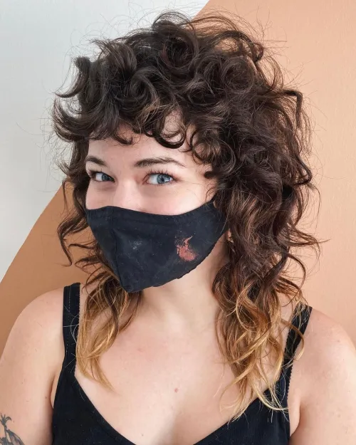 Curly Woman with a Mullet Haircut 
